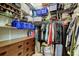 Walk-in closet features lots of storage space with shelves, racks, and dresser for folded clothes at 592 Deer W Run, Palm Harbor, FL 34684