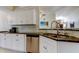 Well-lit kitchen featuring stainless steel appliances, a breakfast bar, and bright countertops at 592 Deer W Run, Palm Harbor, FL 34684