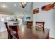 Open-concept living area featuring updated kitchen with bar seating, living room, and dining room at 592 Deer W Run, Palm Harbor, FL 34684