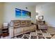 Bright living room with vinyl floors, neutral walls, and comfortable seating arrangement at 592 Deer W Run, Palm Harbor, FL 34684