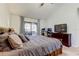 Spacious main bedroom with vaulted ceiling, dresser, and sliding glass door to patio at 592 Deer W Run, Palm Harbor, FL 34684