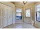Bright sunroom with tile floors, windows, and a door leading to the outside at 592 Deer W Run, Palm Harbor, FL 34684