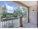 Enjoy neighborhood views from this balcony with white railings and a peaceful atmosphere at 6036 Fishhawk Crossing Blvd, Lithia, FL 33547