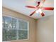 Bedroom featuring a ceiling fan and a large window at 6036 Fishhawk Crossing Blvd, Lithia, FL 33547