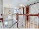 Staircase leading to rooms with barn doors and railing at 6036 Fishhawk Crossing Blvd, Lithia, FL 33547