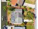 Aerial view of home, landscaping, boat dock, and waterfront at 8706 Tahiti Ln, Tampa, FL 33615