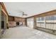 Unfinished living room with fireplace and sliding glass door leading to exterior at 8706 Tahiti Ln, Tampa, FL 33615