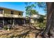 View of the backyard of the home with a screened-in patio at 9037 Pebble Creek Dr, Tampa, FL 33647