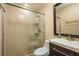 The bathroom has a glass shower and sleek modern vanity at 9037 Pebble Creek Dr, Tampa, FL 33647