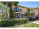 Charming townhouse featuring a private balcony and well-maintained landscaping at 9037 Pebble Creek Dr, Tampa, FL 33647