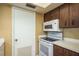 Kitchen with range, microwave and plenty of cabinet space at 9037 Pebble Creek Dr, Tampa, FL 33647