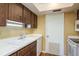 Well-lit kitchen boasts double sinks and efficient storage solutions at 9037 Pebble Creek Dr, Tampa, FL 33647