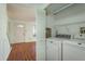 Convenient laundry room with washer, dryer, and ample storage space at 9037 Pebble Creek Dr, Tampa, FL 33647