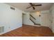 Bright and airy living area features hardwood floors, stairs, and access to other rooms at 9037 Pebble Creek Dr, Tampa, FL 33647