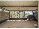Enclosed patio with screens and a view of the backyard at 9037 Pebble Creek Dr, Tampa, FL 33647