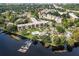 Scenic aerial view of the condominium complex on the water, featuring a private dock and swimming pool at 94 S Highland Ave # 2402, Tarpon Springs, FL 34689