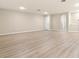 Large, empty room with an open floor plan and neutral paint, ready to customize at 94 S Highland Ave # 2402, Tarpon Springs, FL 34689