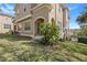 Charming townhouse with lush green lawn, flowering shrub and classic design at 94 S Highland Ave # 2402, Tarpon Springs, FL 34689
