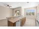 Open kitchen area featuring modern countertops, stainless appliances, and a breakfast bar at 94 S Highland Ave # 2402, Tarpon Springs, FL 34689