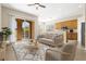 Bright living room with an open balcony and kitchen access, offering a spacious and airy feel at 94 S Highland Ave # 2402, Tarpon Springs, FL 34689