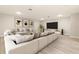 Modern living room featuring a large sectional sofa and entertainment area at 94 S Highland Ave # 2402, Tarpon Springs, FL 34689