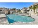 Spacious community pool surrounded by manicured landscaping and inviting lounge chairs at 94 S Highland Ave # 2402, Tarpon Springs, FL 34689