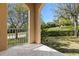 Covered outdoor porch providing a shaded area for relaxing and enjoying the scenery at 94 S Highland Ave # 2402, Tarpon Springs, FL 34689