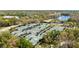 Aerial view of multiple tennis courts with green roofs, perfect for an active lifestyle at 9481 Highland Oak Dr # 516, Tampa, FL 33647