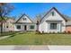 Charming two-story home with a lush green lawn and attractive modern farmhouse details at 0 Old Country Rd, Odessa, FL 33556