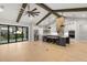Bright, open kitchen featuring beamed ceilings, a large island, and modern stainless appliances at 0 Old Country Rd, Odessa, FL 33556