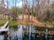 Scenic waterfront view showcasing a private dock and tranquil waters, perfect for lakeside living at 0 Old Country Rd, Odessa, FL 33556