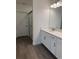 Bathroom featuring a walk-in shower, sleek countertops, and modern fixtures at 10578 Gable Dig Loop, San Antonio, FL 33576