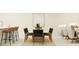 Bright dining area features modern decor, stylish chairs, and a white dining table at 10578 Gable Dig Loop, San Antonio, FL 33576