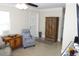 Inviting living room with neutral tones, a decorative cabinet, and a comfortable chair at 1120 45Th N St, St Petersburg, FL 33713