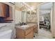 Bathroom with a wood vanity, a gray countertop, and tiled floors at 11240 Windsor Place Circle Cir, Tampa, FL 33626