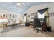 Eclectic bedroom features unique decor, vaulted ceilings with cloud art, and a versatile layout for living or office at 11240 Windsor Place Circle Cir, Tampa, FL 33626