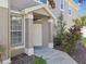 Inviting front entrance with a covered porch, enhancing curb appeal and providing a welcoming first impression at 11240 Windsor Place Circle Cir, Tampa, FL 33626