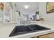 Modern kitchen features a spacious counter overlooking living area, perfect for entertaining and everyday living at 11240 Windsor Place Circle Cir, Tampa, FL 33626