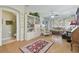 Comfortable living room with neutral colors, bright windows, and wood laminate flooring at 11240 Windsor Place Circle Cir, Tampa, FL 33626