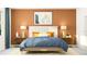 Cozy bedroom featuring a comfortable bed, warm lighting, and stylish nightstands and art at 11853 Sparkling Topaz Cv, Parrish, FL 34219