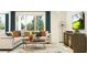 Comfortable living room with large windows, stylish furnishings, and contemporary decor at 11853 Sparkling Topaz Cv, Parrish, FL 34219