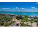 Overhead shot shows a condo building with water views, parking, and nearby street at 1270 Gulf Blvd # 506, Clearwater Beach, FL 33767