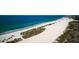 Breathtaking aerial view of a white sand beach along the coast with blue-green water at 1270 Gulf Blvd # 506, Clearwater Beach, FL 33767