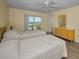 Bright bedroom with beds and dresser at 1270 Gulf Blvd # 506, Clearwater Beach, FL 33767