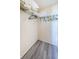 Small closet with clothing rack and overhead storage at 1270 Gulf Blvd # 506, Clearwater Beach, FL 33767