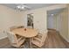 Cozy dining area with a ceiling fan and wood-look flooring, adjacent to the kitchen at 1270 Gulf Blvd # 506, Clearwater Beach, FL 33767