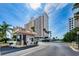 A condo building entrance featuring a security booth for controlled access at 1270 Gulf Blvd # 506, Clearwater Beach, FL 33767