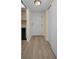 Condo hallway featuring wood floors, closet space, and neutral color palette at 1270 Gulf Blvd # 506, Clearwater Beach, FL 33767