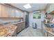 Well-lit kitchen featuring granite countertops, and stainless-steel appliances at 1270 Gulf Blvd # 506, Clearwater Beach, FL 33767