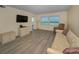 Comfortable living space with a view, featuring a cozy sofa and modern entertainment center at 1270 Gulf Blvd # 506, Clearwater Beach, FL 33767